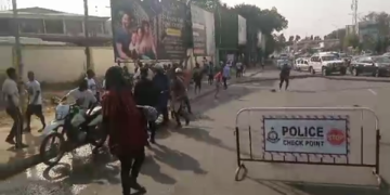 NDC supporters besiege Greater Accra Regional Collation Center demands re-collation of Weija Gbawe Parliamentary result